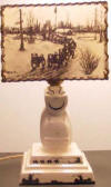 Ceramic Billikin lamp with Ahgupuk lamp shade dog sled scene